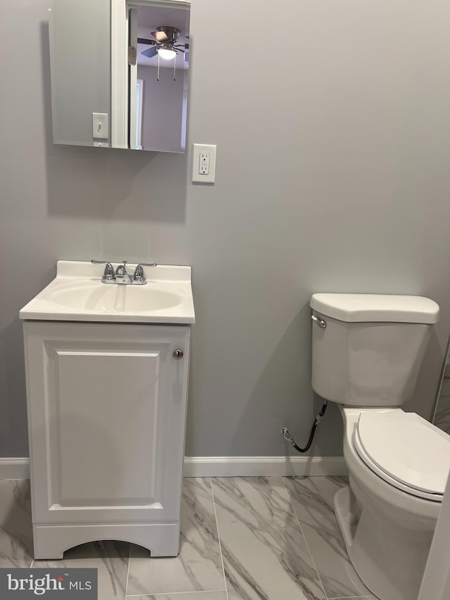 2036 W Ontario St, Philadelphia, PA 19140 - bathroom with marble look tile flooring, vanity, and a ceiling fan