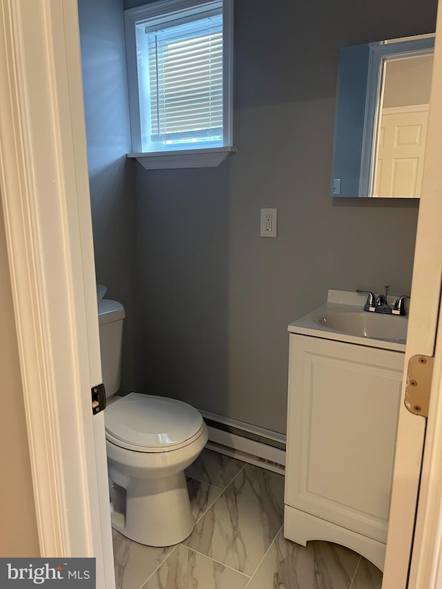 2036 W Ontario St, Philadelphia, PA 19140 - bathroom with a baseboard heating unit, marble finish flooring, and vanity