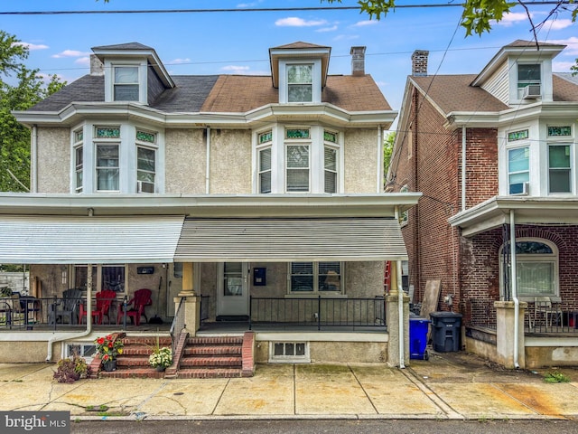 171 N York St, Pottstown, PA 19464 - view of front of home with a porch, stucco siding, and cooling unit