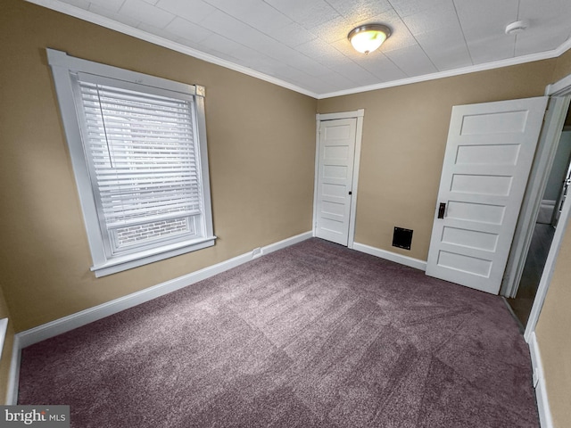 171 N York St, Pottstown, PA 19464 - unfurnished bedroom featuring dark carpet, ornamental molding, and a closet