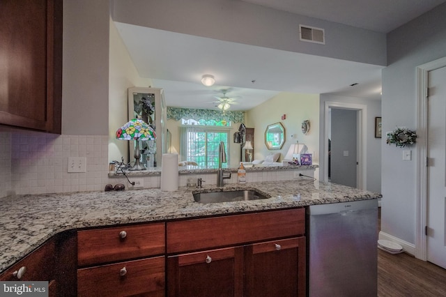 1000 Fountanview Cir, Newark, DE 19713 - kitchen with stainless steel dishwasher, tasteful backsplash, ceiling fan, light stone counters, and dark wood-type flooring