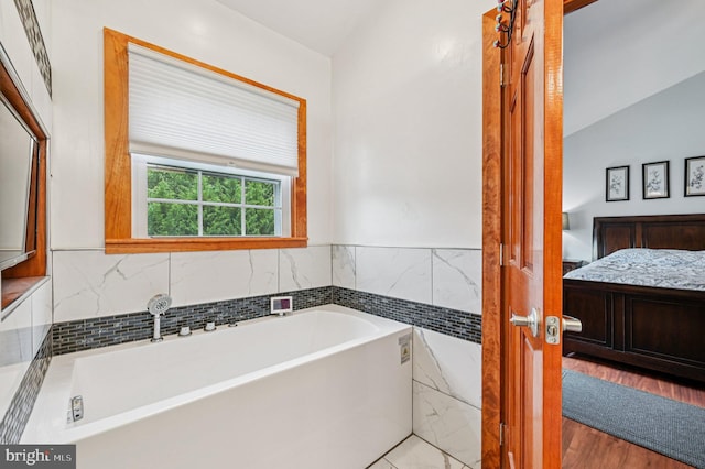 1802 Disney Estates Cir, Severn, MD 21144 - bathroom featuring a bath and wood finished floors