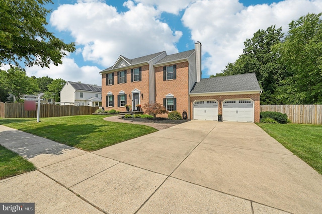 1802 Disney Estates Cir, Severn, MD 21144 - view of front of house featuring brick siding, an attached garage, a chimney, concrete driveway, and roof with shingles