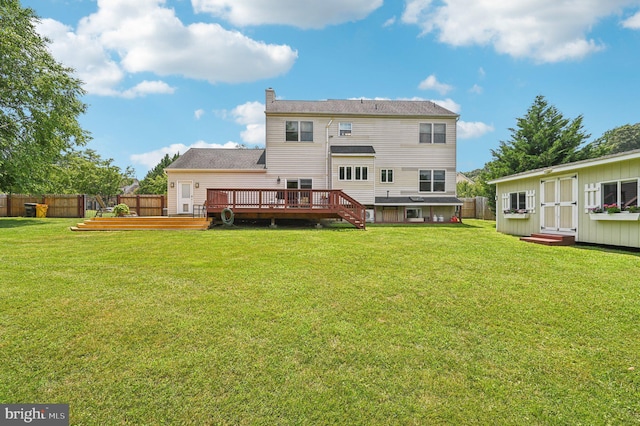 1802 Disney Estates Cir, Severn, MD 21144 - back of house featuring a wooden deck, a chimney, and an outdoor structure