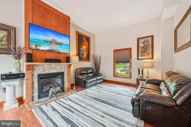 1802 Disney Estates Cir, Severn, MD 21144 - living area featuring wood finished floors and a fireplace with flush hearth