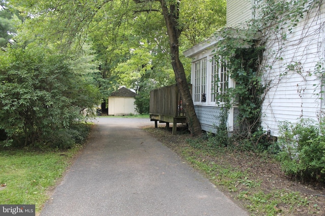 1628 River Rd, Upper Black Eddy, PA 18972 - view of side of home with asphalt driveway and a deck