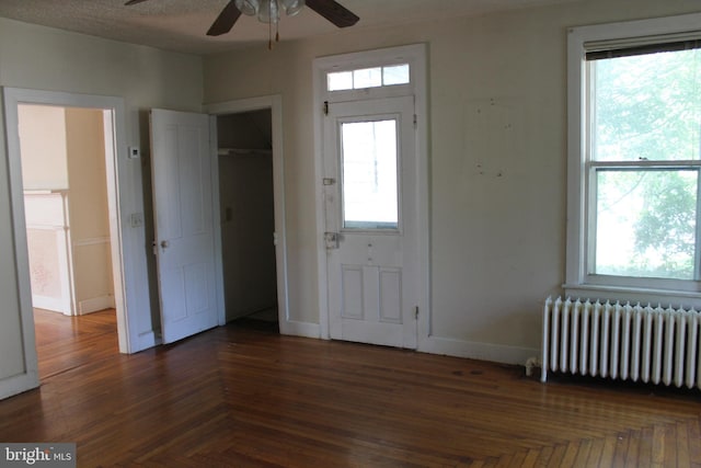 1628 River Rd, Upper Black Eddy, PA 18972 - foyer featuring radiator heating unit, ceiling fan, and healthy amount of natural light