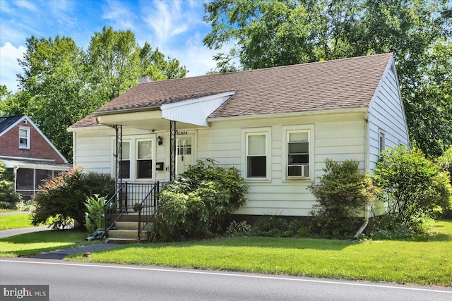 30 N Dwight St, Reading, PA 19609 - bungalow with a front lawn, a chimney, and a shingled roof