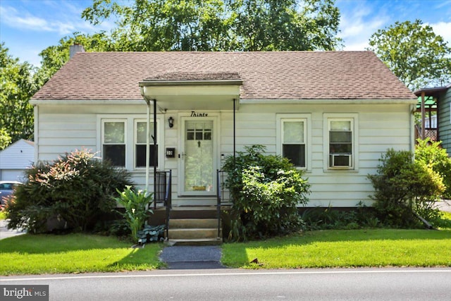 30 N Dwight St, Reading, PA 19609 - view of front of home with a chimney and a front yard