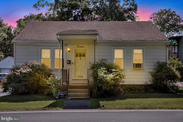 30 N Dwight St, Reading, PA 19609 - view of front of house with a front yard and roof with shingles