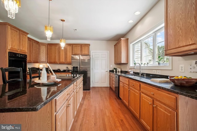 2907 Dumas St, Alexandria, VA 22306 - kitchen with stainless steel refrigerator with ice dispenser, black dishwasher, light wood-type flooring, dark stone counters, and recessed lighting