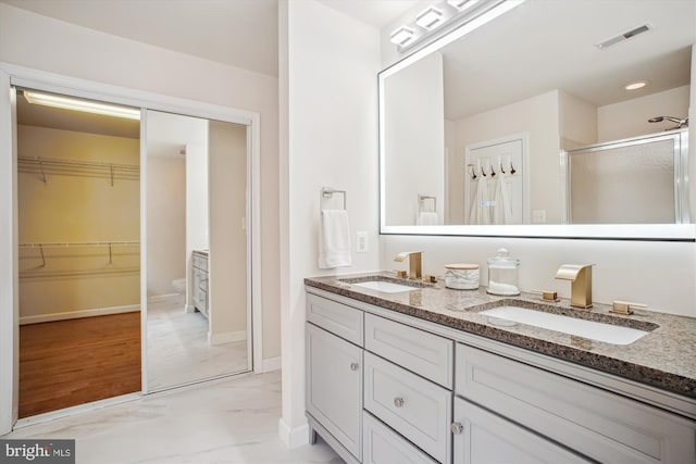 2907 Dumas St, Alexandria, VA 22306 - full bathroom with a shower stall, double vanity, and a spacious closet