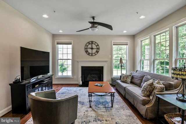 1413 Triton Ct, Edgewater, MD 21037 - living room featuring ceiling fan, plenty of natural light, wood finished floors, recessed lighting, and a glass covered fireplace