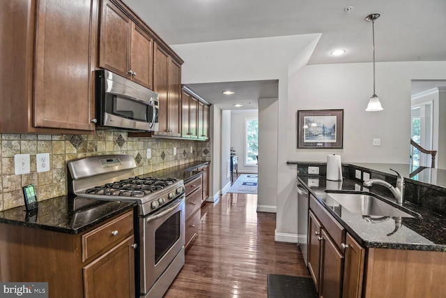 1413 Triton Ct, Edgewater, MD 21037 - kitchen with stainless steel appliances, dark stone counters, tasteful backsplash, dark wood-style flooring, and recessed lighting