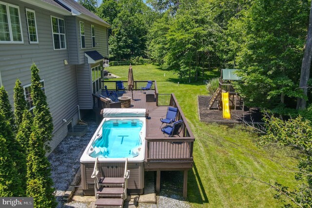 1413 Triton Ct, Edgewater, MD 21037 - view of pool featuring a playground, a wooden deck, a lawn, view of scattered trees, and a swimming pool