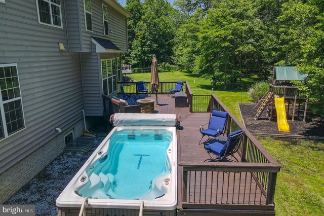 1413 Triton Ct, Edgewater, MD 21037 - view of pool with a playground, a yard, a deck, and view of wooded area