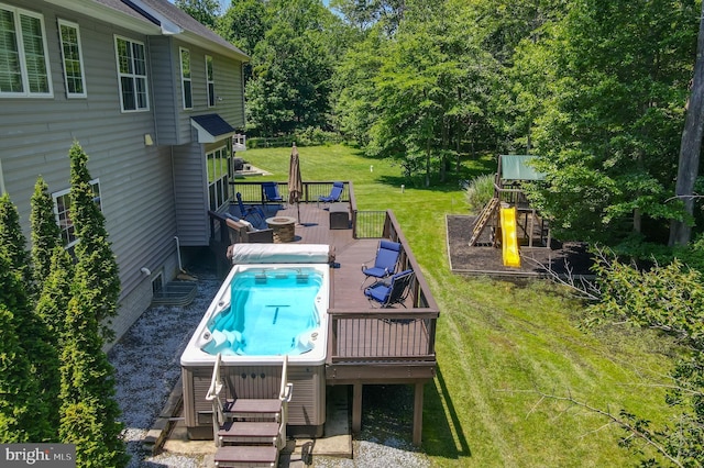 1413 Triton Ct, Edgewater, MD 21037 - view of pool featuring a playground, a wooden deck, a lawn, view of scattered trees, and a swimming pool