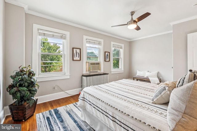 1818 Newton St NE, Washington, DC 20018 - bedroom with radiator, crown molding, wood finished floors, and ceiling fan