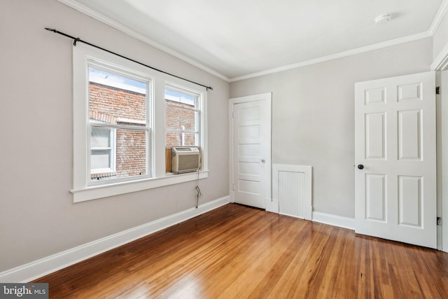 1818 Newton St NE, Washington, DC 20018 - spare room featuring a smoke detector, wood finished floors, crown molding, and cooling unit