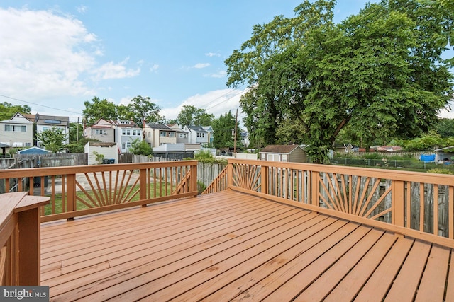 1818 Newton St NE, Washington, DC 20018 - wooden terrace featuring a residential view, a fenced backyard, and a storage shed