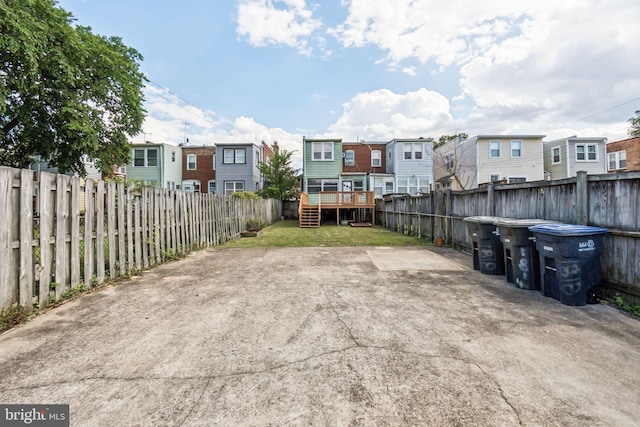 1818 Newton St NE, Washington, DC 20018 - fenced backyard featuring a residential view, a wooden deck, and stairway