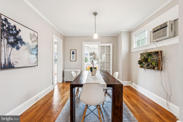 1818 Newton St NE, Washington, DC 20018 - dining area featuring radiator, wood finished floors, crown molding, and an AC wall unit