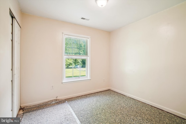 14050 Oaks Rd, Hughesville, MD 20637 - unfurnished bedroom with a closet and speckled floor