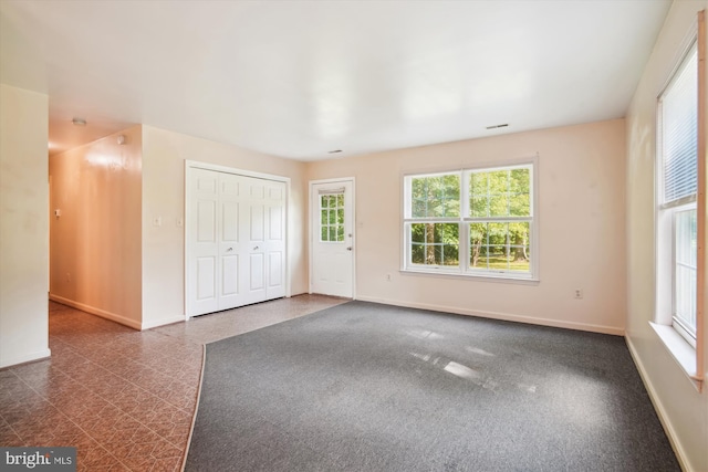 14050 Oaks Rd, Hughesville, MD 20637 - unfurnished bedroom with dark floors and a closet