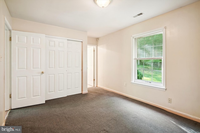 14050 Oaks Rd, Hughesville, MD 20637 - unfurnished bedroom featuring carpet floors and a closet