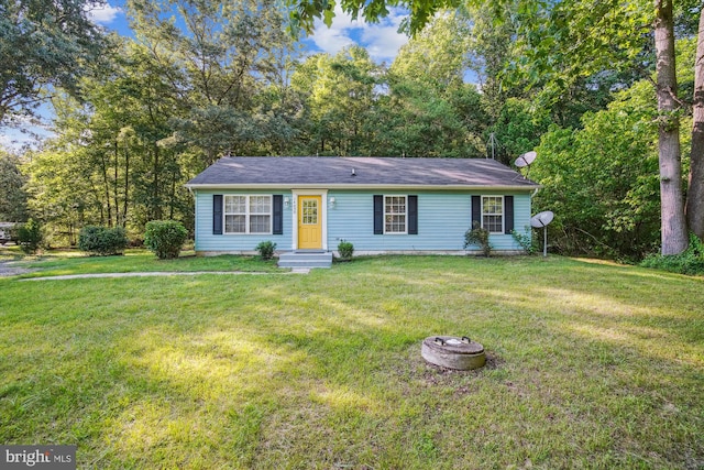 14050 Oaks Rd, Hughesville, MD 20637 - ranch-style house with a front yard and a fire pit