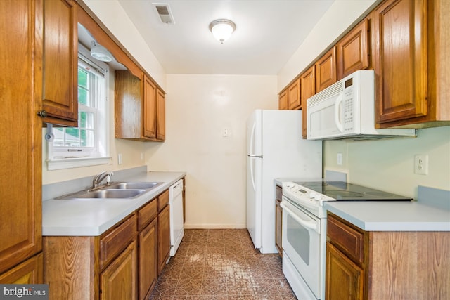 14050 Oaks Rd, Hughesville, MD 20637 - kitchen featuring white appliances, brown cabinets, light countertops, and tile patterned floors