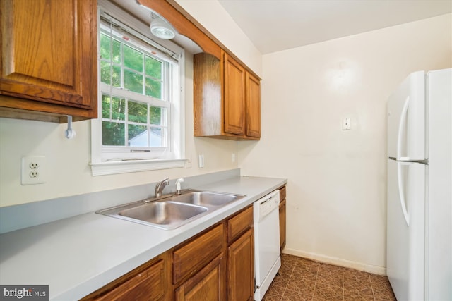 14050 Oaks Rd, Hughesville, MD 20637 - kitchen with white appliances, brown cabinetry, and light countertops
