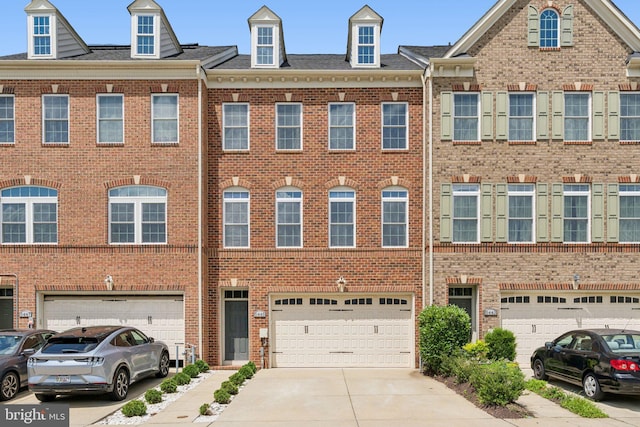 5445 Stream Bank Ln, Greenbelt, MD 20770 - multi unit property featuring brick siding, a garage, and driveway