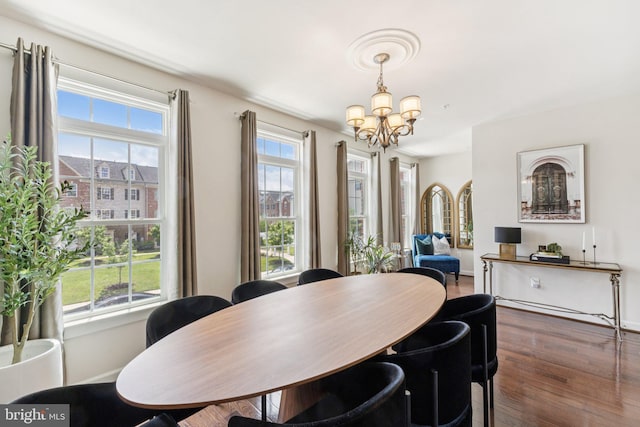 5445 Stream Bank Ln, Greenbelt, MD 20770 - dining space featuring a chandelier, healthy amount of natural light, and wood finished floors