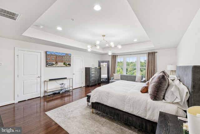 5445 Stream Bank Ln, Greenbelt, MD 20770 - bedroom featuring a raised ceiling, a chandelier, recessed lighting, and dark wood-style floors