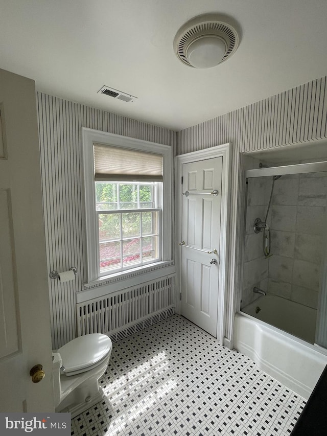 257 Jefferson St, Winchester, VA 22601 - bathroom with radiator heating unit, wallpapered walls,  shower combination, and tile patterned floors