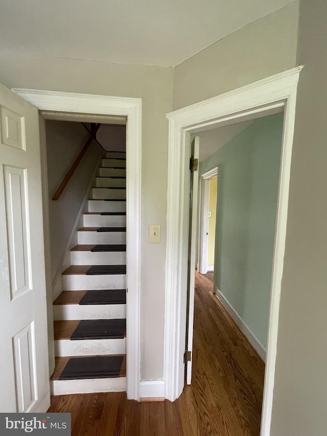 257 Jefferson St, Winchester, VA 22601 - staircase featuring wood finished floors and baseboards