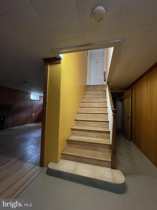 257 Jefferson St, Winchester, VA 22601 - stairway featuring wooden walls and wood finished floors