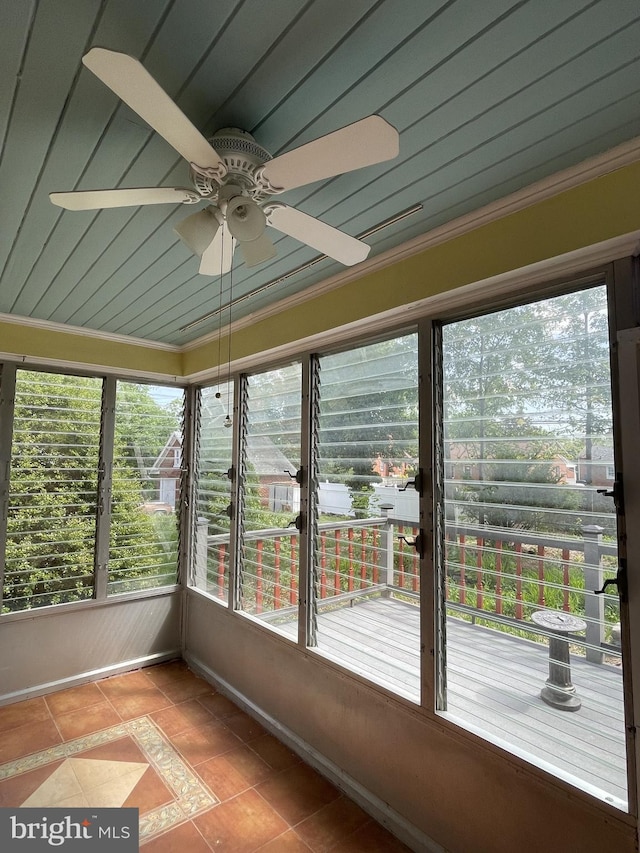 257 Jefferson St, Winchester, VA 22601 - unfurnished sunroom with a ceiling fan, tile patterned floors, and crown molding