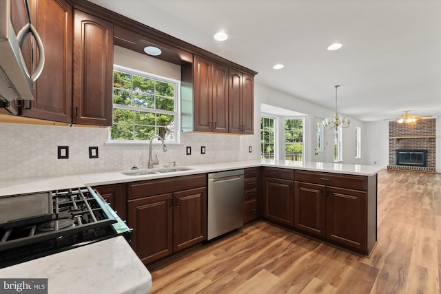27 Brown Cir, Fredericksburg, VA 22405 - kitchen featuring stainless steel dishwasher, light wood-style flooring, healthy amount of natural light, light countertops, and recessed lighting
