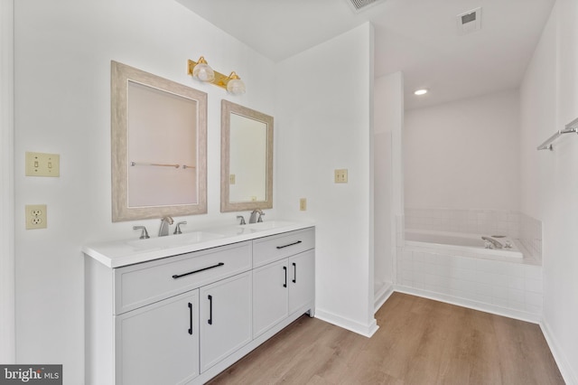 27 Brown Cir, Fredericksburg, VA 22405 - full bathroom featuring double vanity, wood finished floors, a garden tub, and recessed lighting