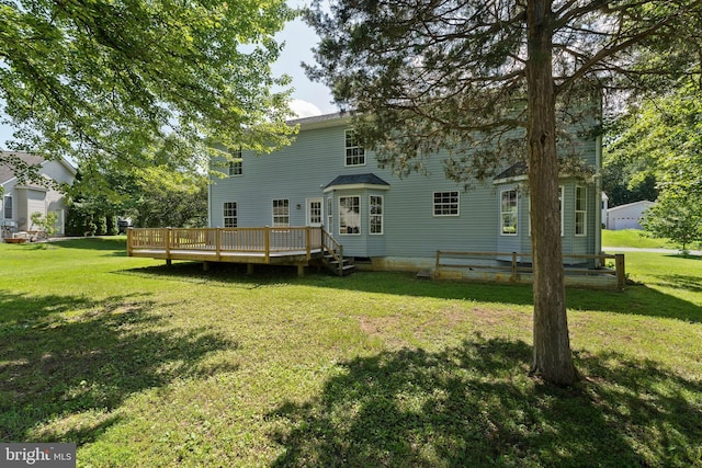 27 Brown Cir, Fredericksburg, VA 22405 - back of property featuring a wooden deck and a yard