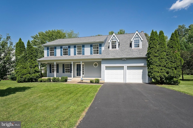 27 Brown Cir, Fredericksburg, VA 22405 - view of front of house with driveway, a front lawn, a porch, and a chimney