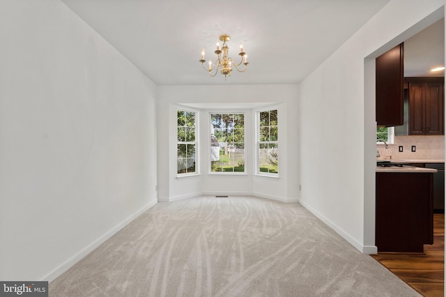 27 Brown Cir, Fredericksburg, VA 22405 - unfurnished dining area with a chandelier and light colored carpet