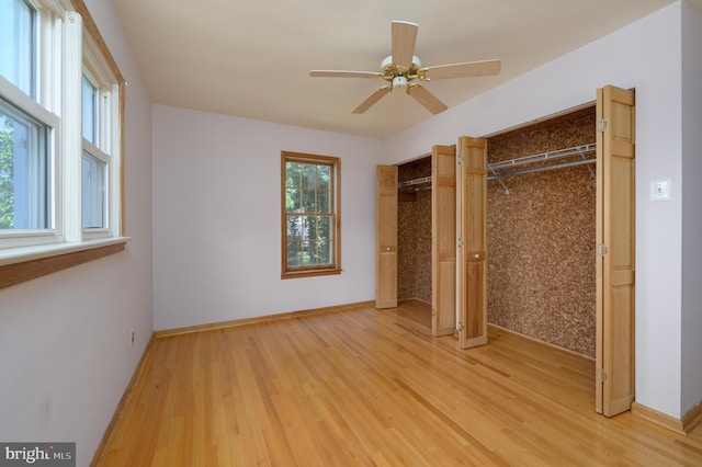 26 Rose Ln, Cherry Hill, NJ 08002 - unfurnished bedroom with multiple closets, light wood-style flooring, and a ceiling fan