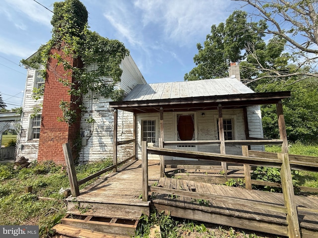 505 Battlefield Ft, Defiance, VA 24437 - view of front facade featuring a metal roof and a chimney