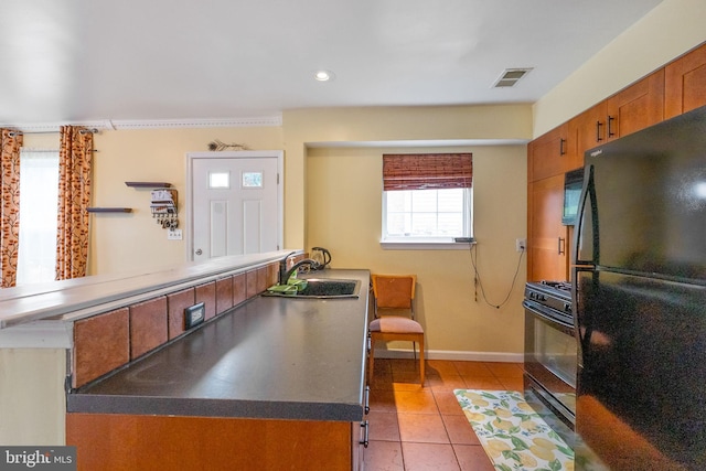 6221 Sandpiper Ct Unit 7, Elkridge, MD 21075 - kitchen featuring black appliances, brown cabinets, light tile patterned floors, and recessed lighting