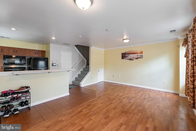 6221 Sandpiper Ct Unit 7, Elkridge, MD 21075 - unfurnished living room featuring stairs, light wood finished floors, ornamental molding, and recessed lighting