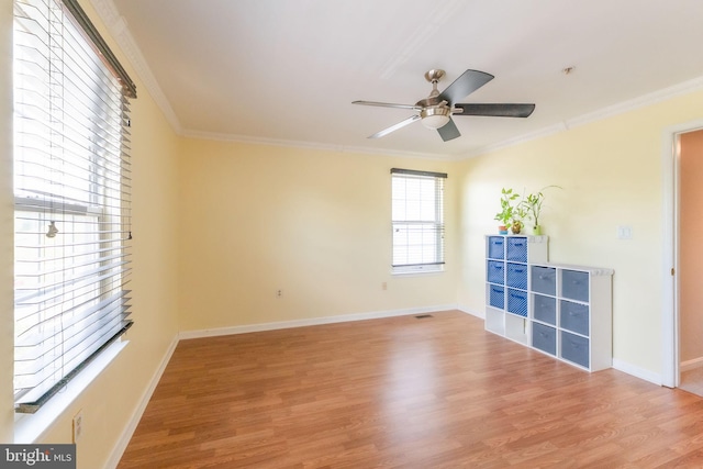 6221 Sandpiper Ct Unit 7, Elkridge, MD 21075 - empty room with wood finished floors, crown molding, and ceiling fan