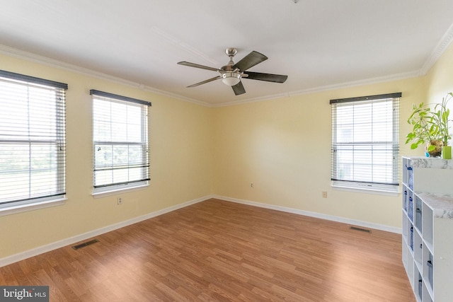 6221 Sandpiper Ct Unit 7, Elkridge, MD 21075 - spare room with light wood-type flooring, ornamental molding, and ceiling fan